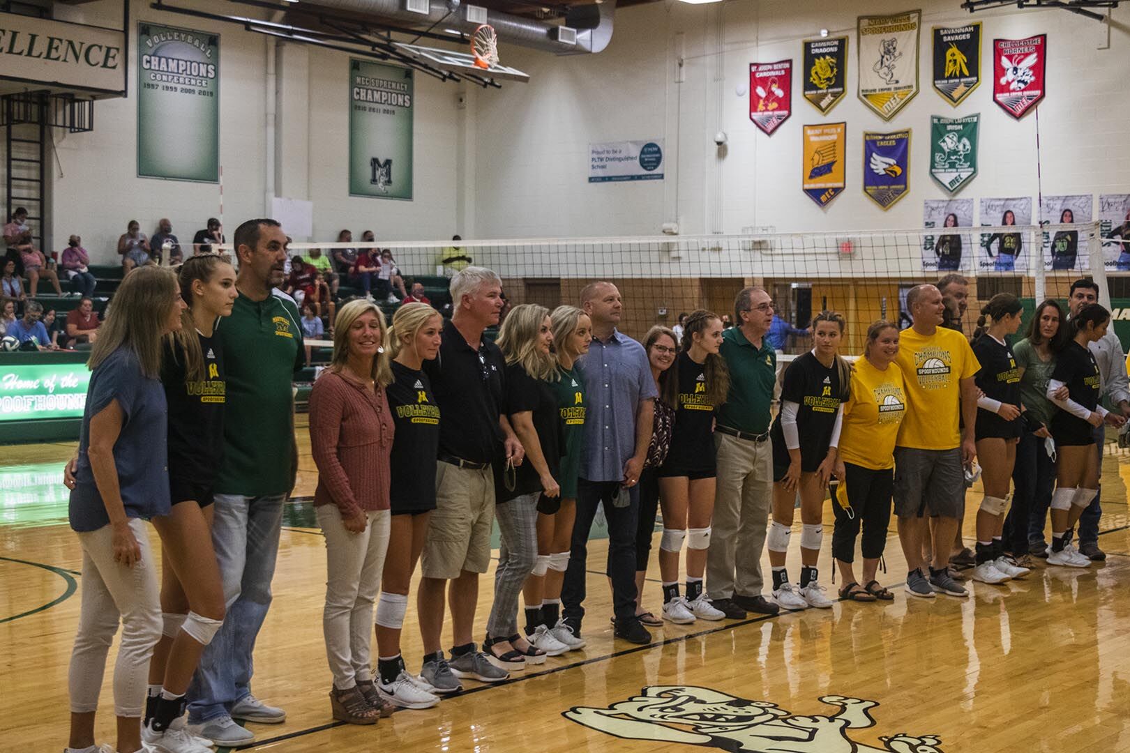 Parents and players line up for senior night photo